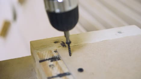 assembling wooden furniture with drill