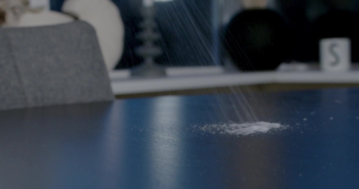 Thoroughly Cleaning the Dining Table with Careful Attention to Detail