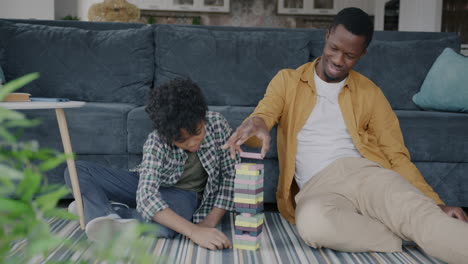 father and son playing with building blocks