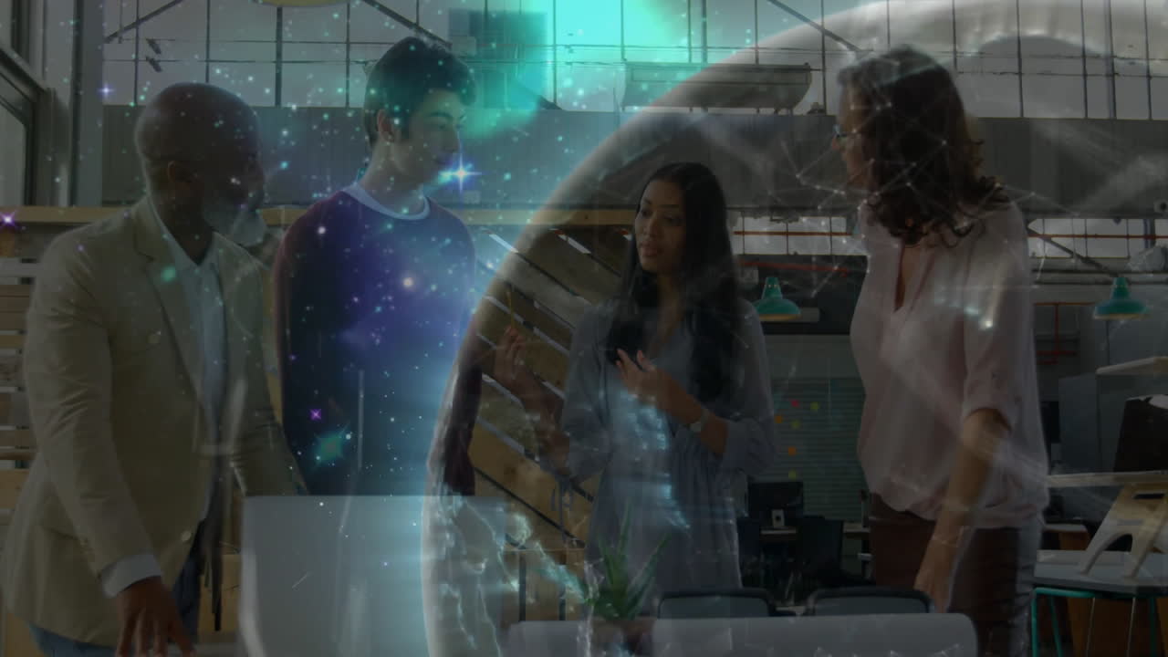 Group of professionals collaborating around tech workshop table, projecting glowing Earth hologram