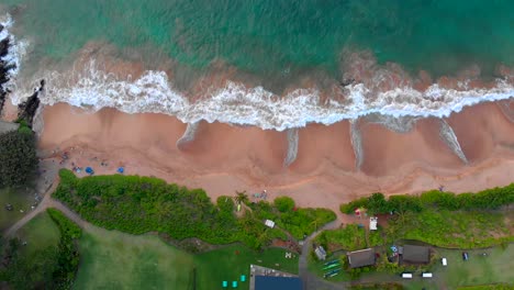 beautiful epic 4k drone shot in maui near kihei looking down at at beach right rotation stable altitude