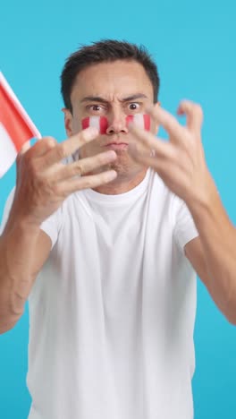 man cheering for peru, angry with the decision of referee