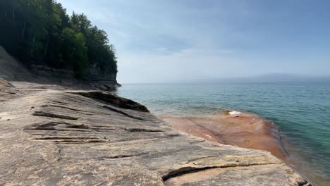 Pictured-Rocks-Lake-Superior-Coast-With-Trees-and-Rocks-Large-Rock-Formations-Coastal-Sunny-Day