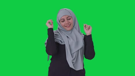 Happy-Muslim-woman-dancing-and-enjoying-Green-screen