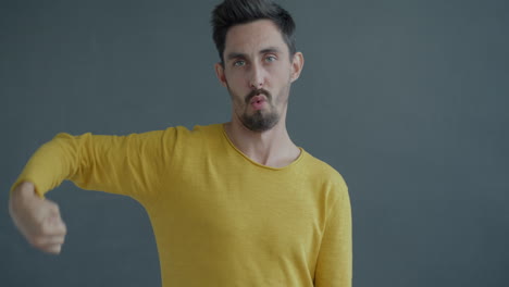 man expressing various emotions, possibly celebrating