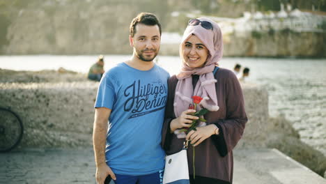 couple posing by the sea