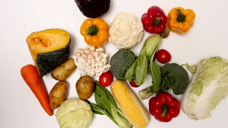 fresh vegetables on white background. stop motion animation loop