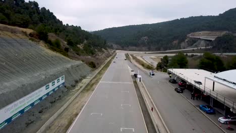 porsche-911-overtaking-another-car-on-the-main-straight-of-a-race-track