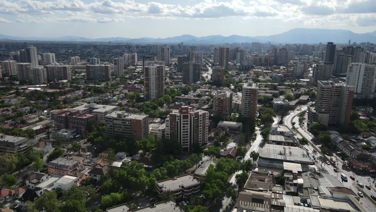 Urban sprawl of santiago de chile featuring providencia and las condes districts with the andes mountains in the background