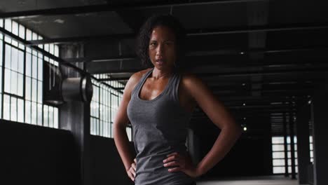 Portrait-of-african-american-woman-taking-a-break-breathing-heavily-and-looking-at-the-camera