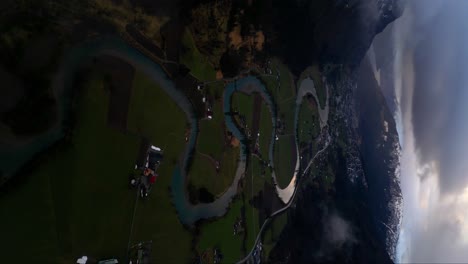 vertical shot of the winding stryn river in vestland on dusk, norway.
