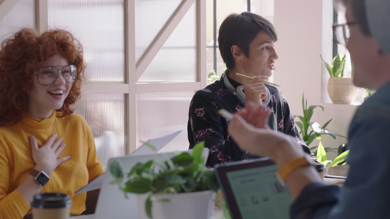 young group of students meeting caucasian team leader man brainstorming sharing creative ideas enjoying conversation friends discussing business project in modern office workplace