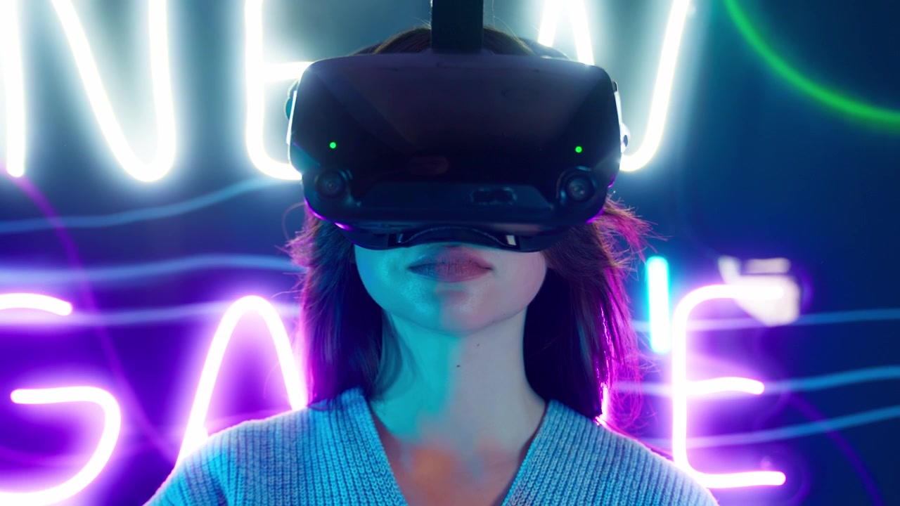 Young Woman Puts on VR Headset in a Neon Lit Room