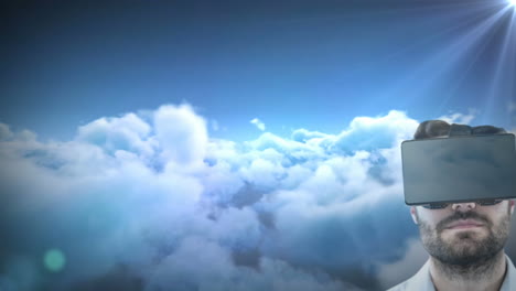 hombre caucásico usando auriculares vr contra el punto de luz y las nubes en el cielo