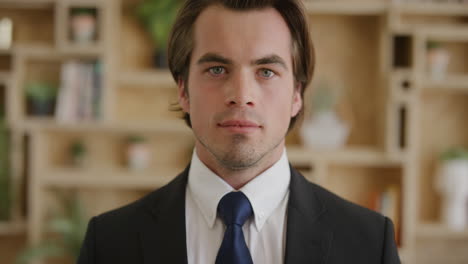 clsoe up portrait of attractive young businessman looking confident at camera wearing stylish suit real people series