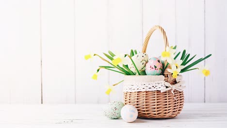 easter basket with flowers and eggs