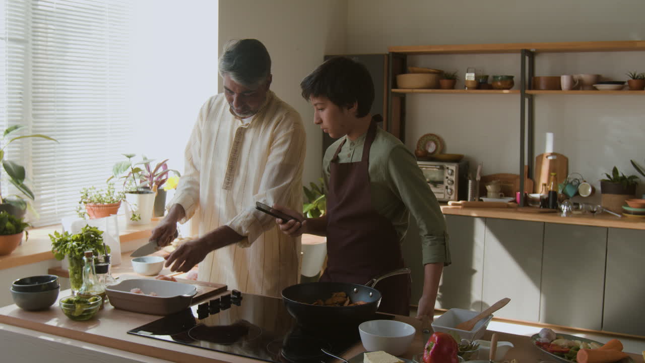 Father and Son Cooking Together in the Kitchen