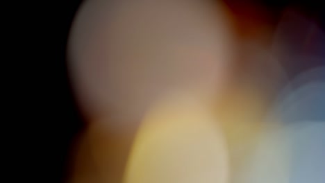 multicolored light leaks footage on black background, lens flare leak burst overlays transitions