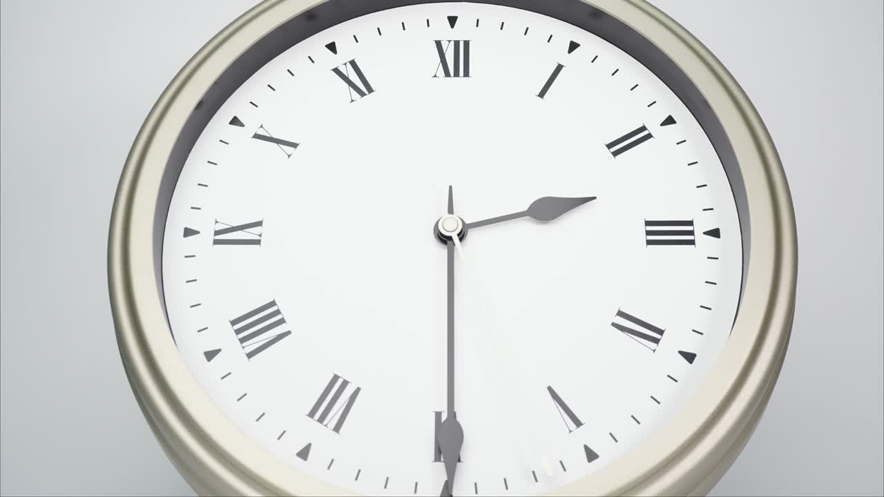 Time lapse silver wall clock show the time 2 minutes to 3 p.m.