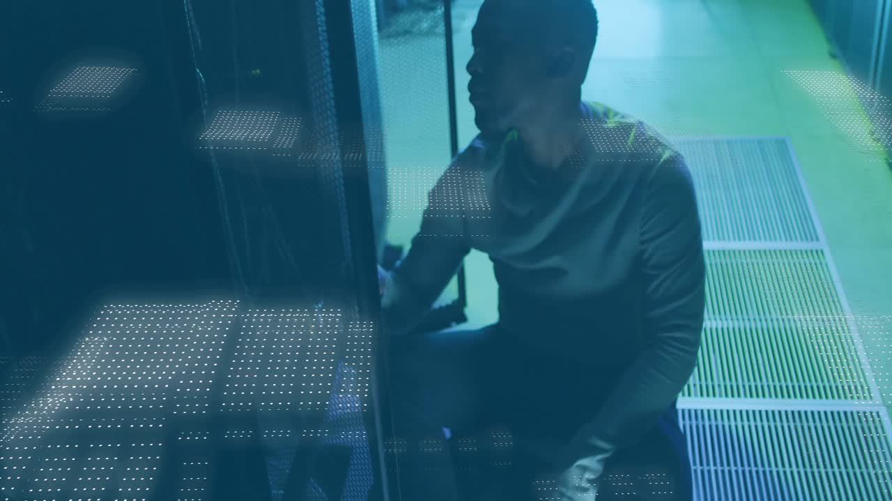 Entering data center and kneeling by server rack IT tech executing maintenance with binary overlays