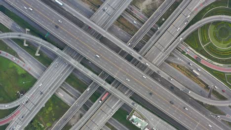 high angle looking top down view of complicate road and expressway intersection in bangkok city of thailand. shot by drone can use for transportation or abstract concept.