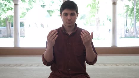 Young-man-praying-in-masjid