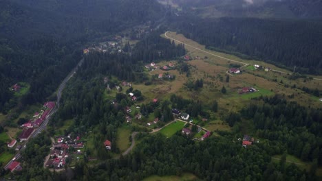 Pull-back-drone-shot-revealing-low-clouds-over