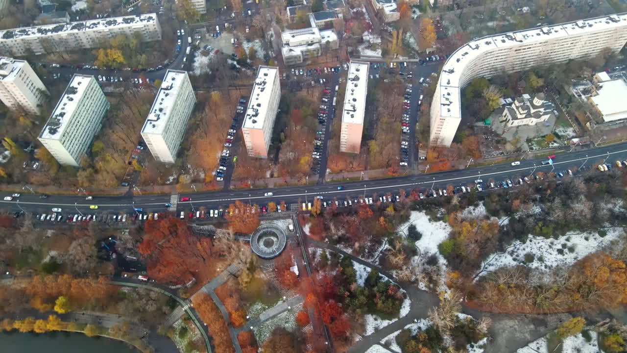 Cityscape of Bucharest from a drone, rows of residential buildings, thermal station with fog getting out and other the ground, ecology idea, Romania