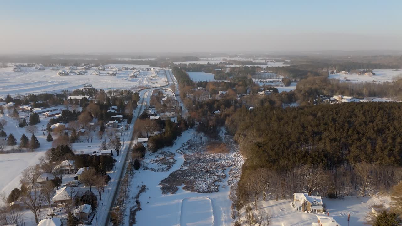 Snowy rural landscape near Alton Mill in Caledon, Ontario, with road and forest
