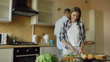 happy couple preparing a healthy meal in the kitchen