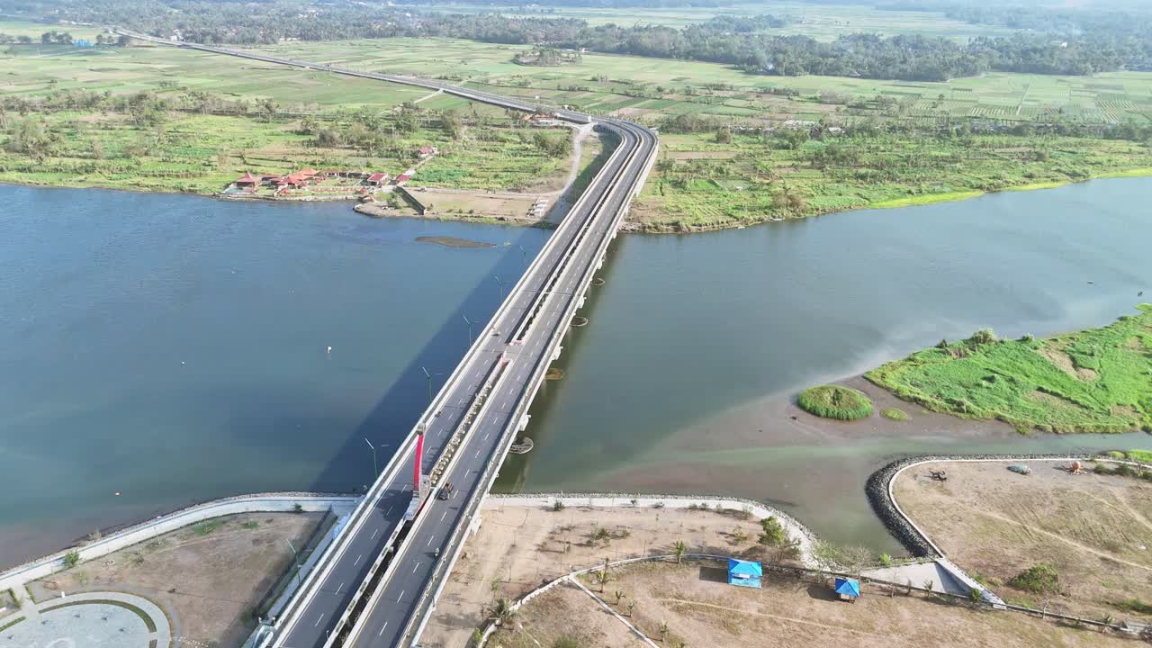 Aerial View of a Bridge Over a River in a Rural Landscape
