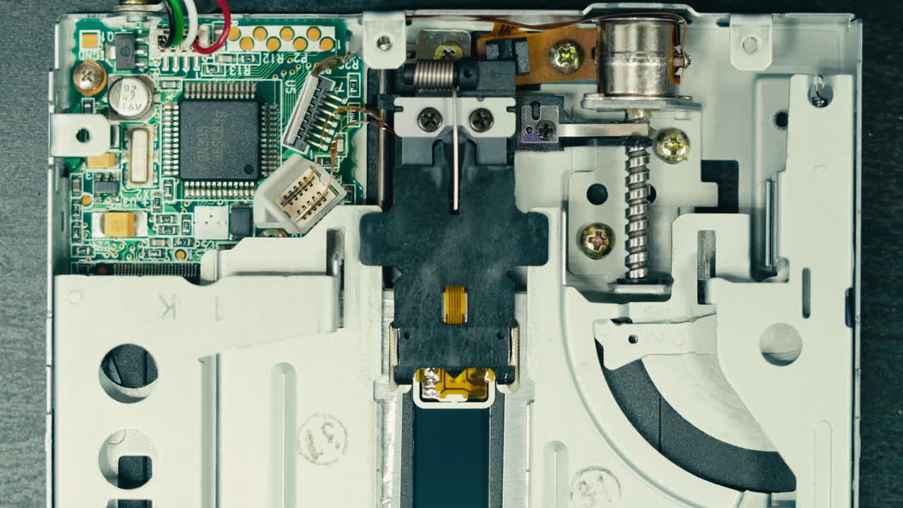 Floppy disc FDD close up, Using diskette for old PC computer macro. Archive programme or Music recorder, playing retro computer games. Vintage device for office, obsolete technology. . High quality 4k footage