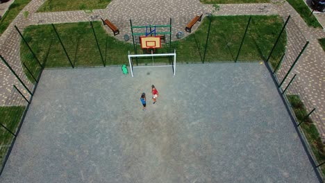 children playing on playground. top down aerial view of children playing on sports field