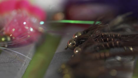 Macro-Shot-Of-Wet-Nymph-Pattern-Trout-And-Salmon-Fly-Fishing-Flies,-Tied-From-Hackle-In-Lure-Box