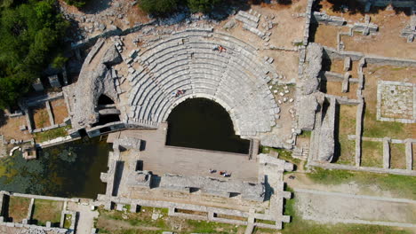 Shot-drone-cenital-Butrint-Roman-amphitheater-and-ruins-in-Albania