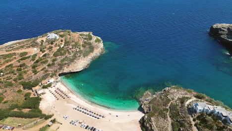 Aerial-drone-video-of-iconic-turquoise-and-sapphire-bay-and-beach-of-Andros,-Cyclades,-Greece