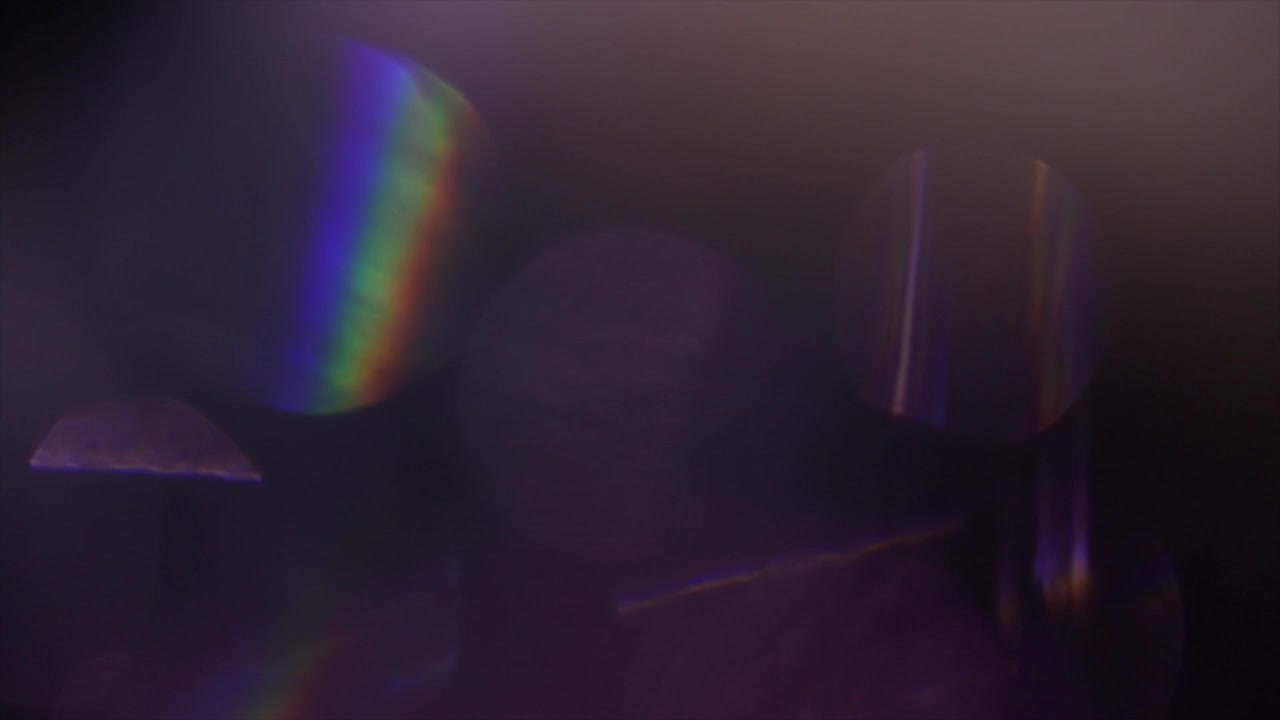 Abstract Colorful Light Leaks and Lens Flares on Dark Background