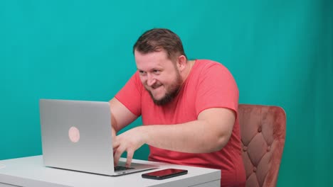 funny frames of male using laptop. man working on a computer pretending to be a hacker