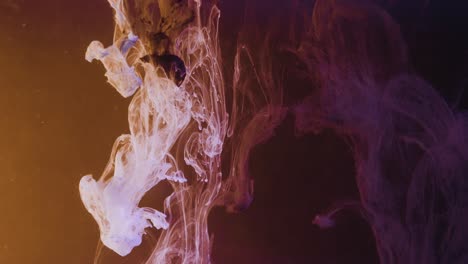 Swirling-explosion-of-paint-water-ink-underwater-with-black-background,close-up-slow-motion