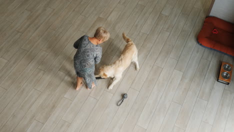 woman cleaning floor with dog