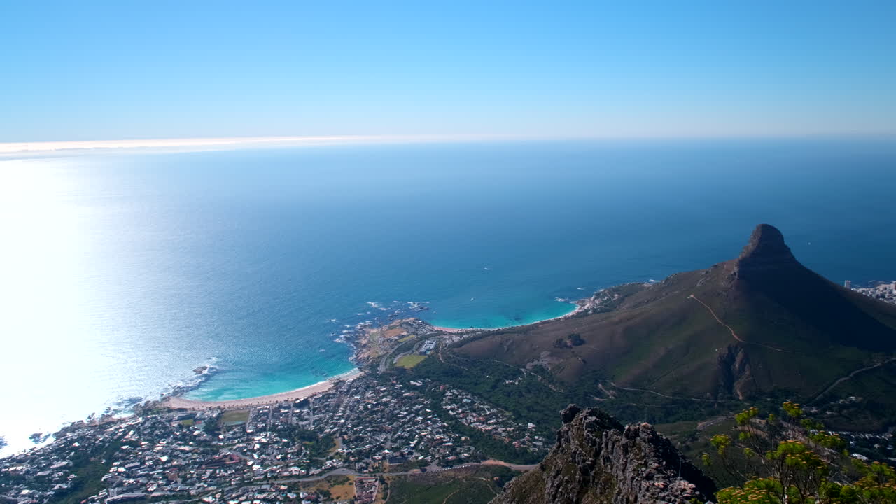 High angle view of Camps Bay and Lion's Head from atop Table Mountain