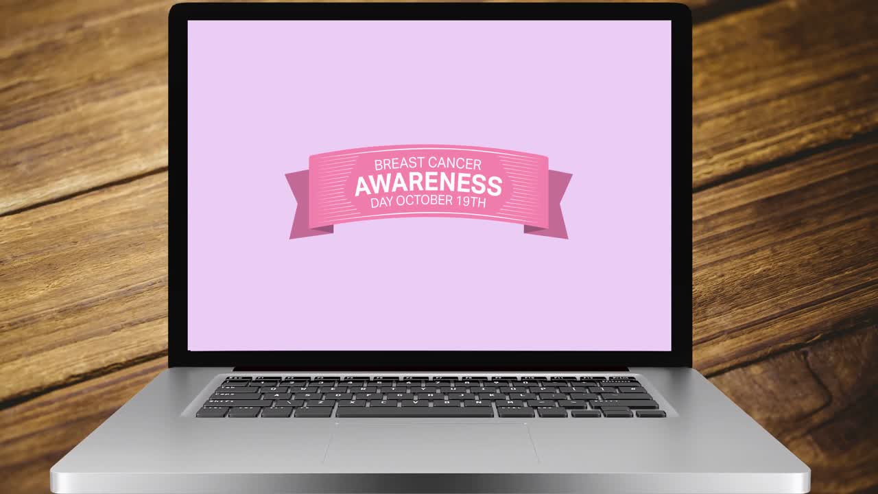 animación del texto de cáncer de mama rosa en la pantalla de un portátil