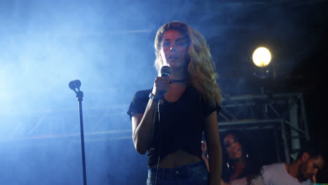 singer performing on stage at a concert 4k