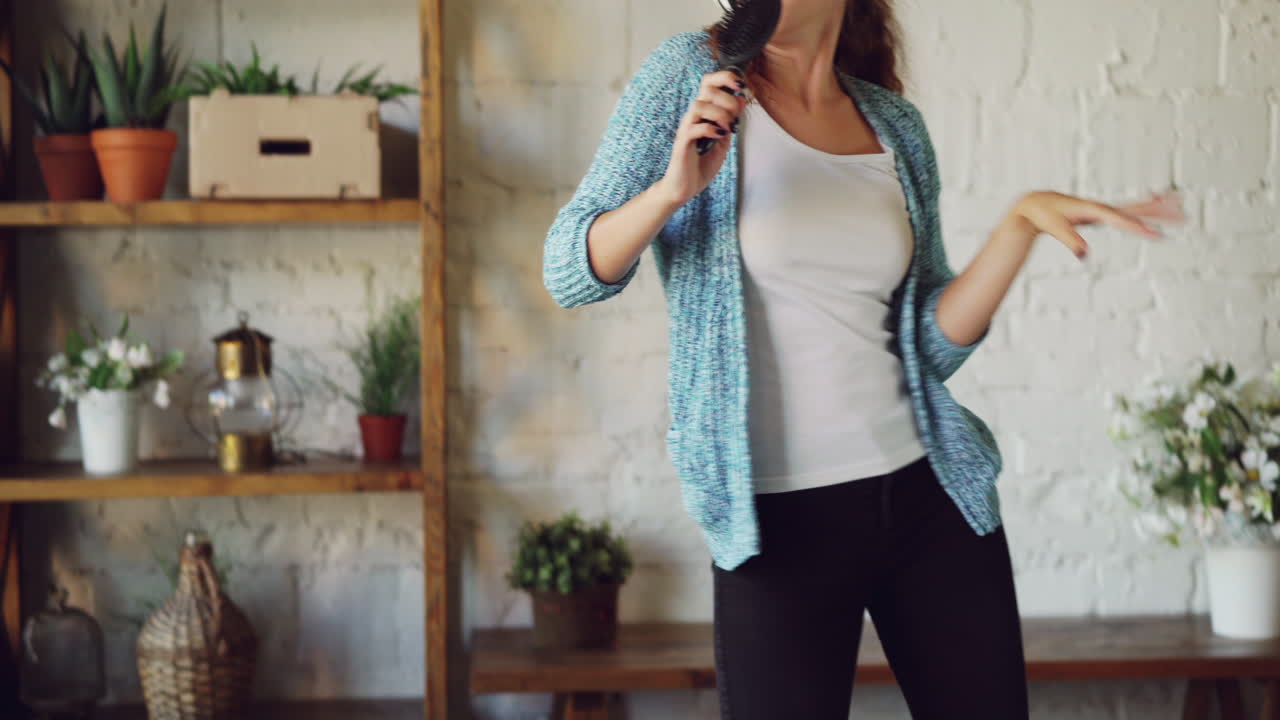 Woman Singing and Dancing at Home