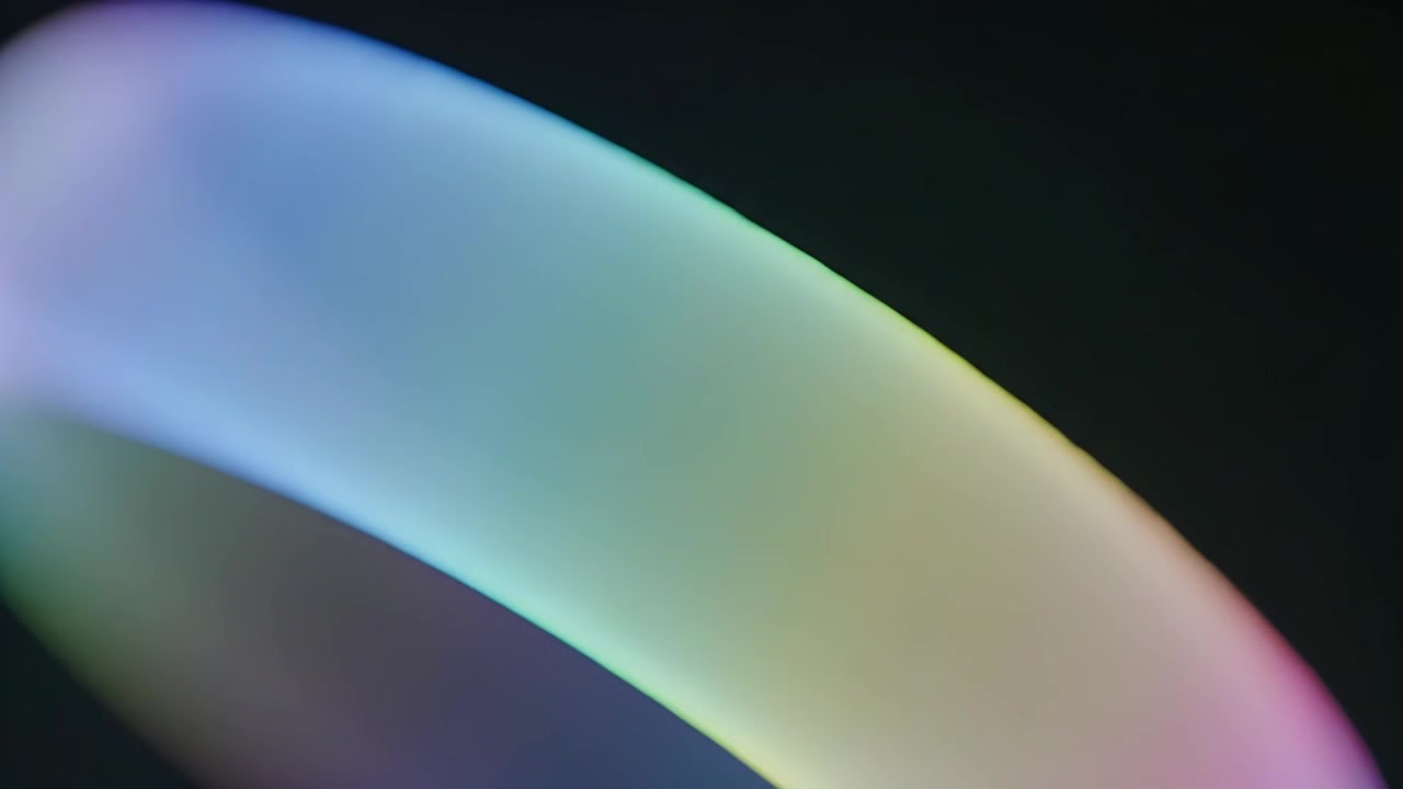 Abstract Gradient Light Ring Rotating on Dark Background