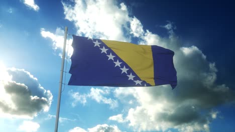 flag of bosnia and herzegovina waving at wind against beautiful blue sky
