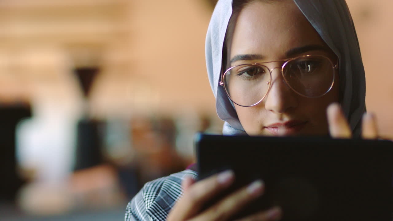 Digital tablet, analytics and muslim woman working