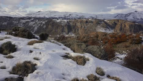 Snow-covered-mountains-and-grassy-valley-near-El-Chalten,-Patagonia,-Argentina