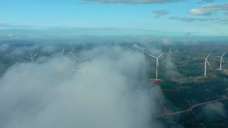 drone view wind power farm covered by cloud in early morning - eahleo, dak lak, central highlands vietnam