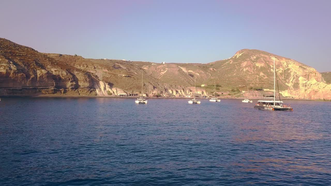 Yachts in Greek Island Bay golden hills